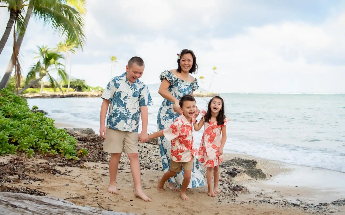 Authentic Made in Hawaii matching aloha shirts and dresses for family photo on the beach