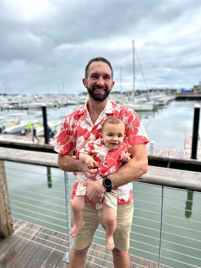 Man wearing a red and white floral short-sleeved shirt