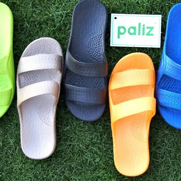 Paliz slide sandals in various colors and materials, featuring a comfortable design with adjustable straps.